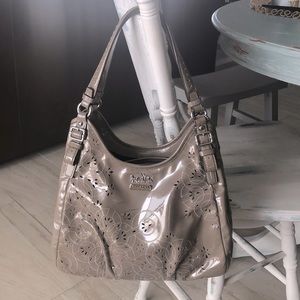 Coach taupe patent leather handbag.